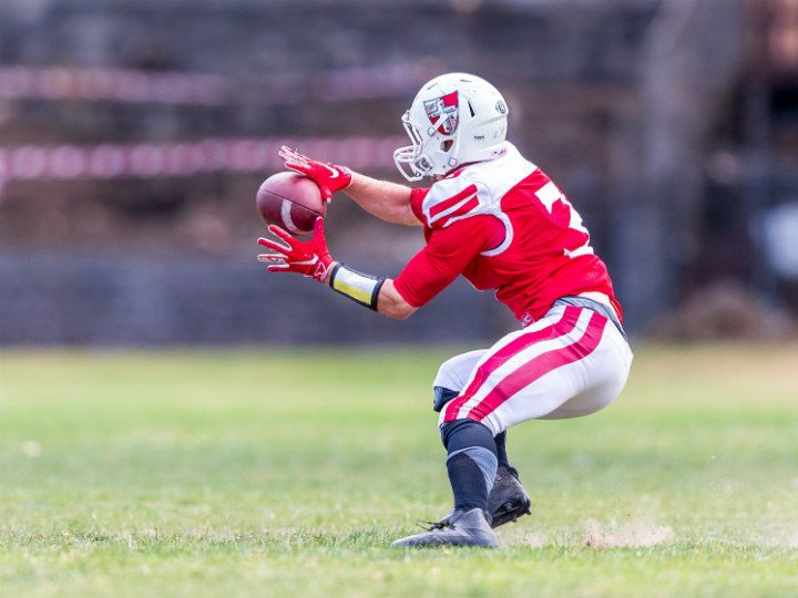 player catching a football