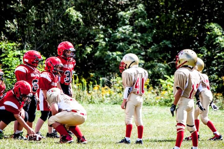 youth-league-football-players-line-up-during-a-game