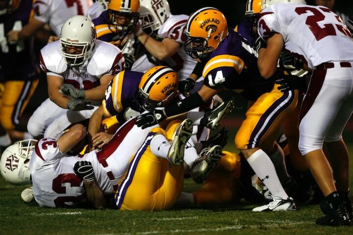 the-defense-uses-a-zero-blitz-to-tackle-the-ball-carrier-during-a-football-game