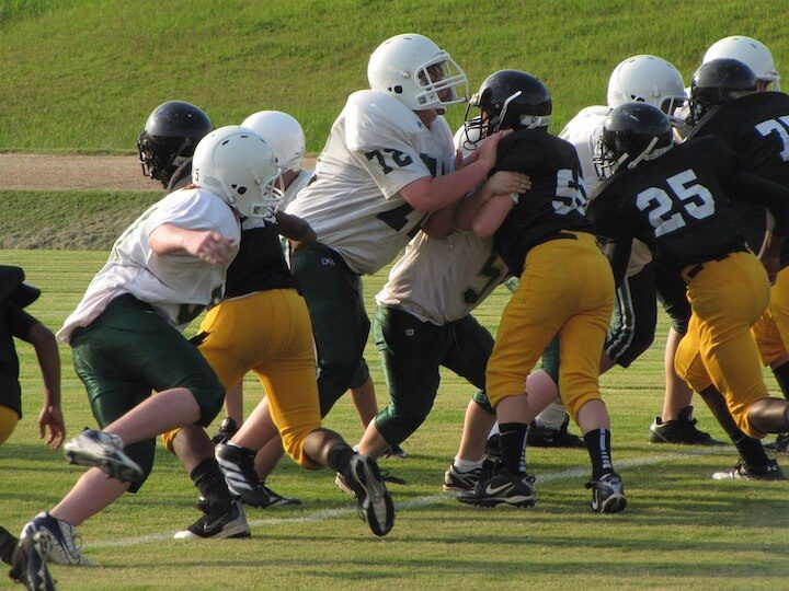 football youth players at the line of scrimmage
